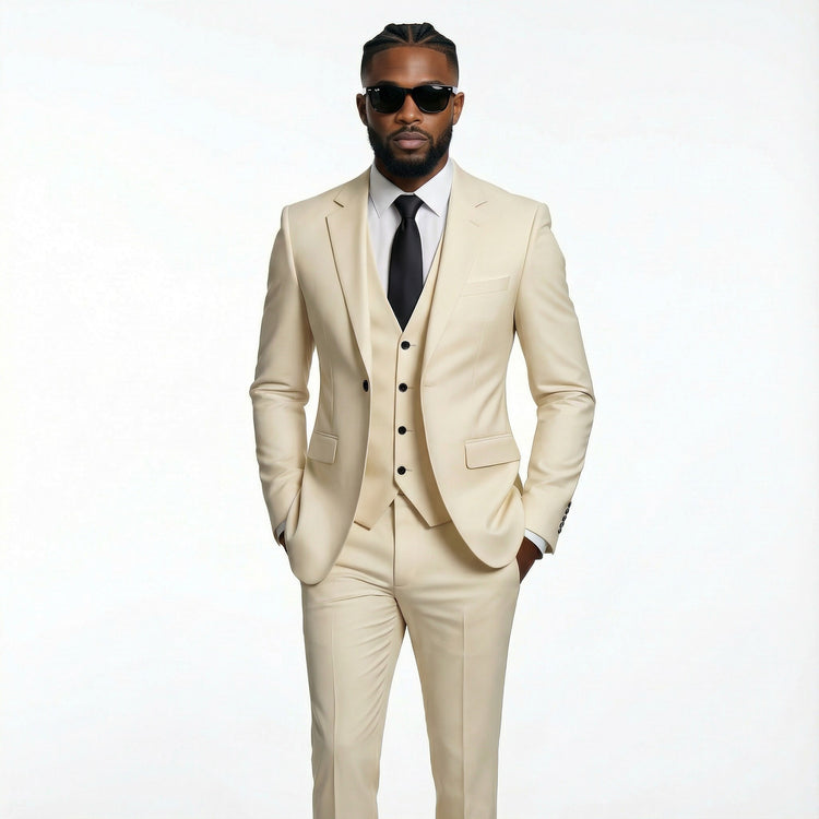 Man wearing a beige suit with sunglasses on a white background
