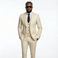 Man wearing a beige suit with sunglasses on a white background