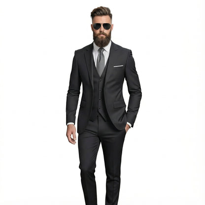 Man wearing a black suit with sunglasses on a white background