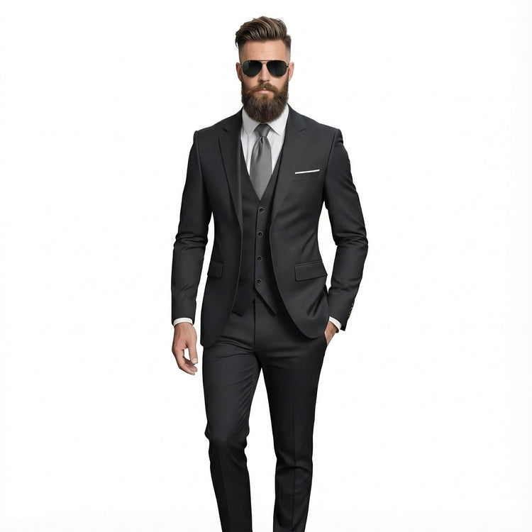 Man wearing a black suit with sunglasses on a white background