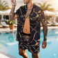 Man wearing a black and gold patterned shirt and shorts by a pool.