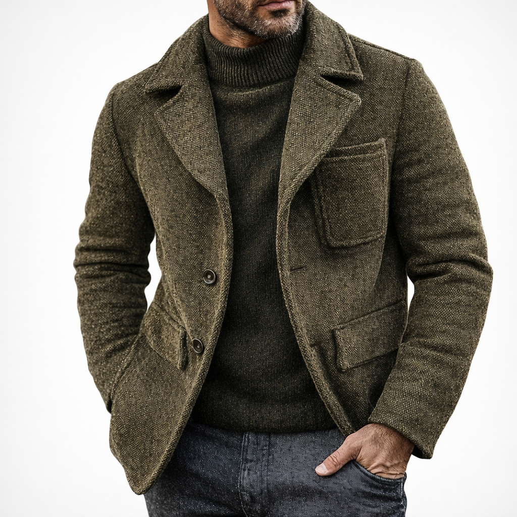 Man wearing a brown textured coat over a dark sweater on a white background