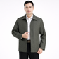 Man wearing a gray jacket over a white shirt on a white background