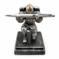 Metallic warrior figurine with a pen on a white background