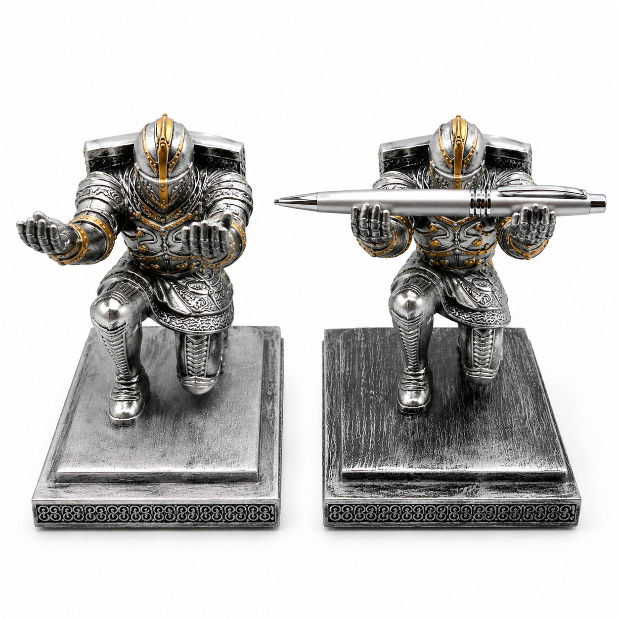 Two metallic warrior figurines on stands with one holding a pen.