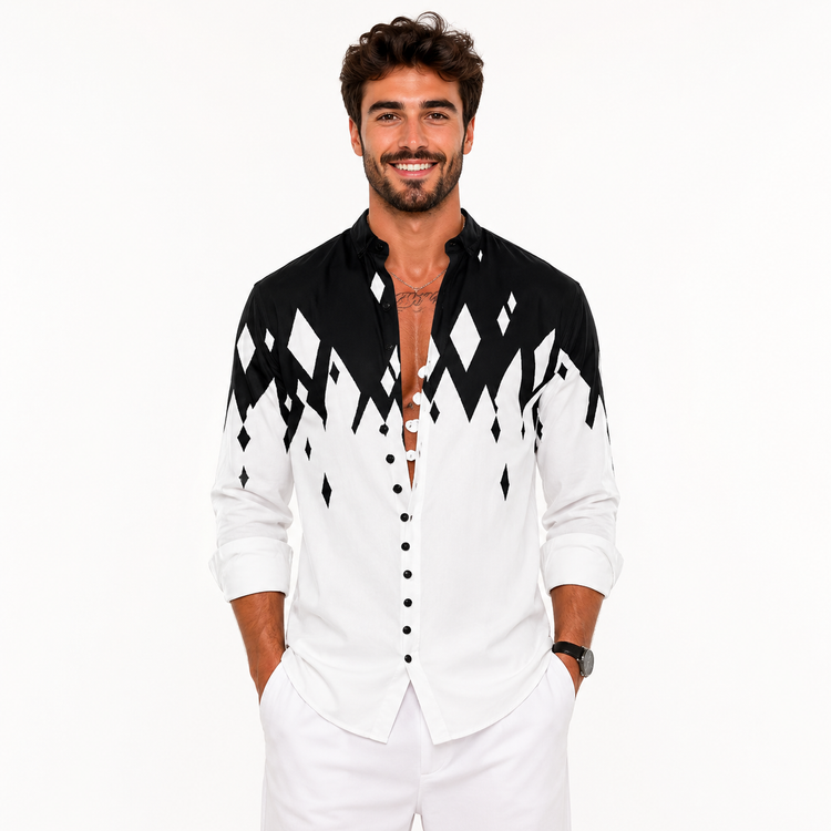 Man wearing a black and white patterned shirt with a plain background