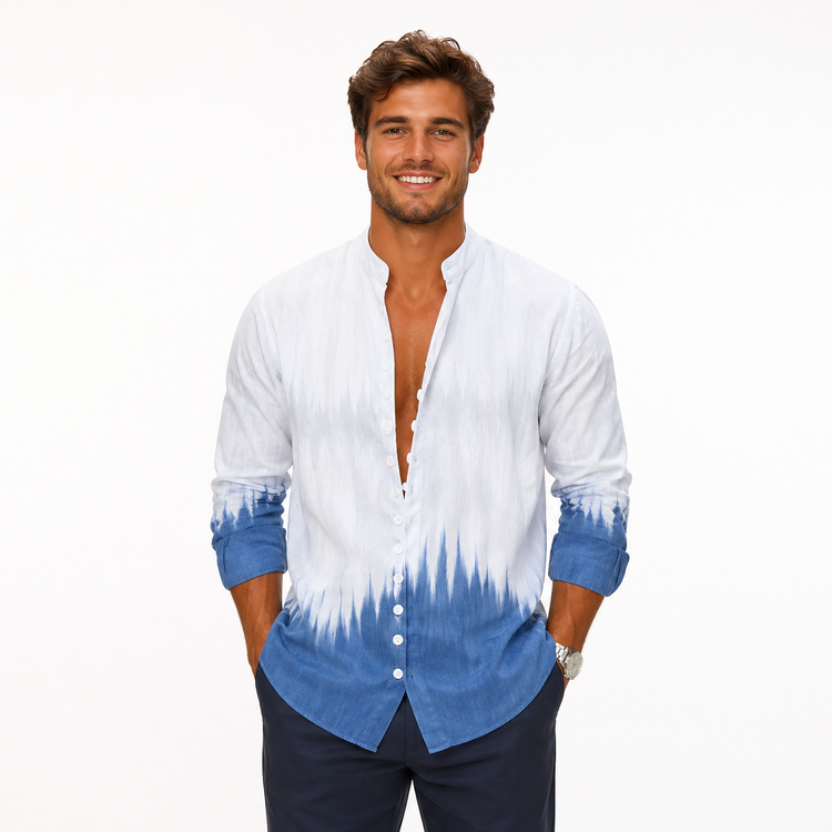 Man wearing a white and blue tie-dye shirt with rolled-up sleeves on a white background