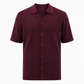Maroon patterned shirt on a white background
