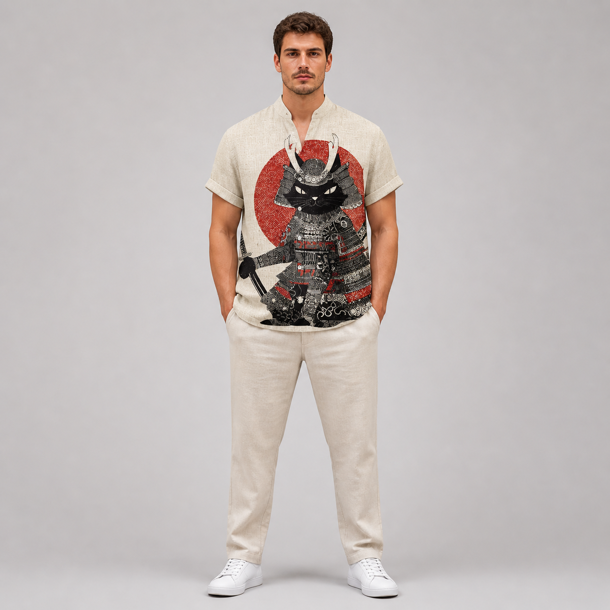 Man wearing a t-shirt with a graphic design on a plain background