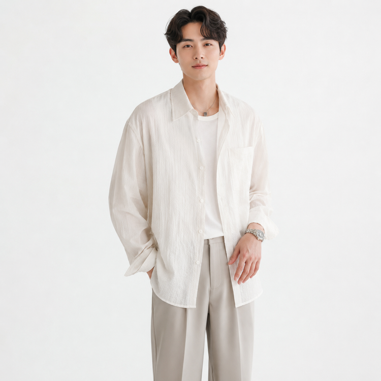 Man wearing a white shirt and beige pants on a white background