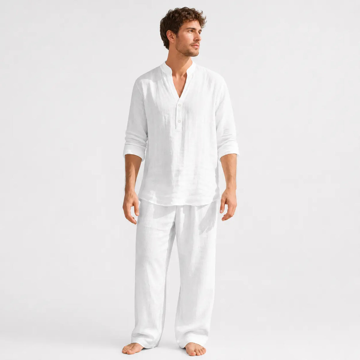 Men's linen henley shirt - solid white long sleeve worn by a model with sleeves rolled up