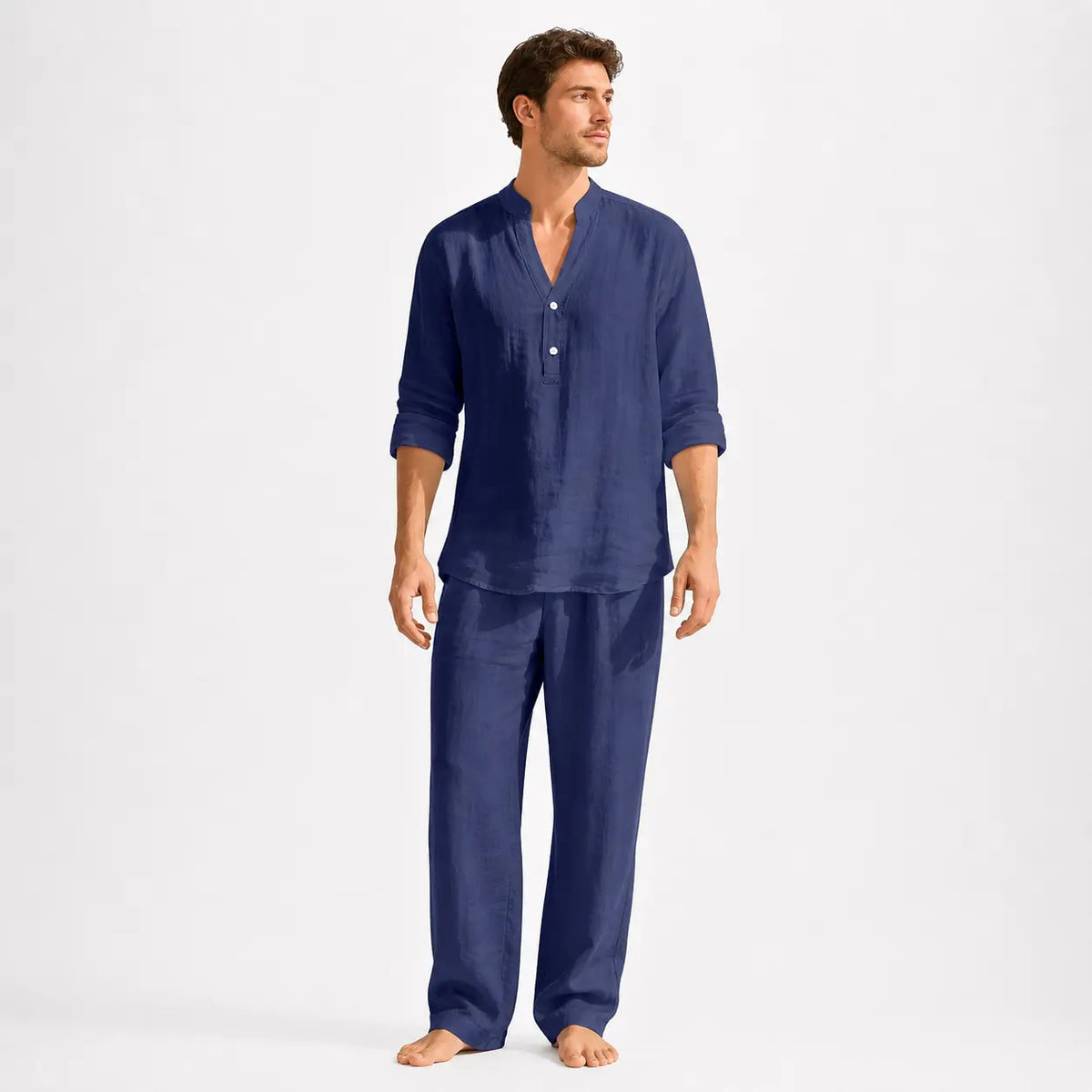 Men's linen henley shirt - solid navy blue long sleeve worn by a model with sleeves rolled up