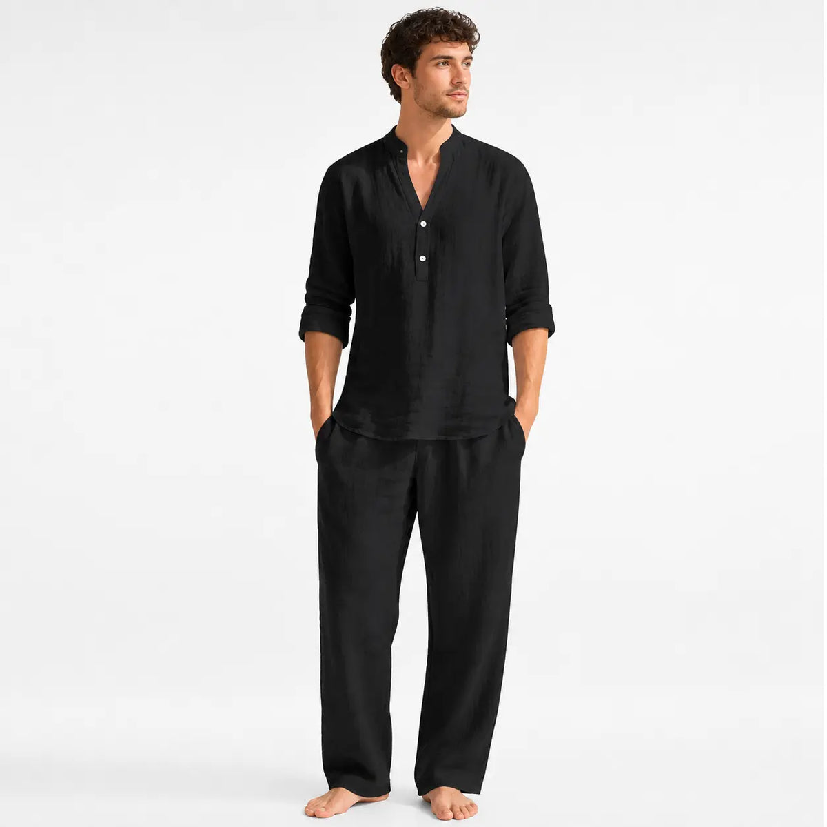 Men's linen henley shirt - solid black long sleeve worn by a model with hands in pockets