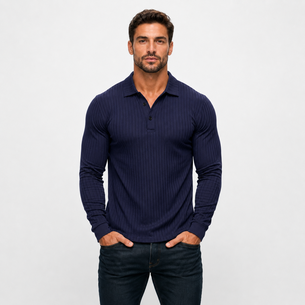 Man wearing a navy ribbed long-sleeve polo shirt against a light gray background