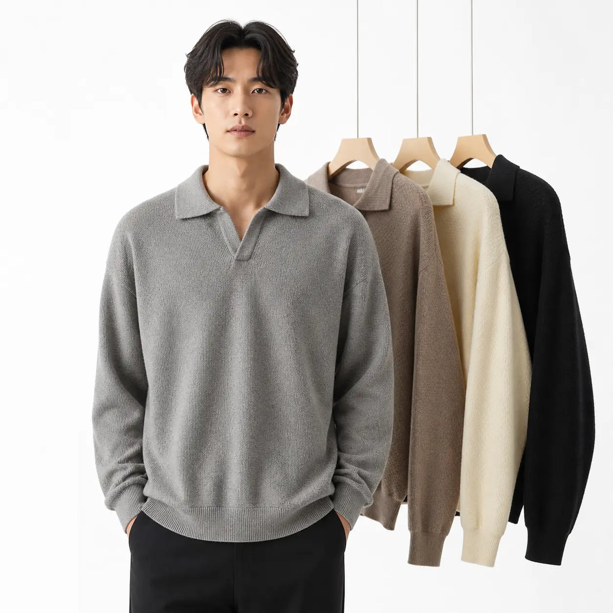 Men's slim fit polo sweater in gray worn by a model with hands in pockets, other colors on hangers behind