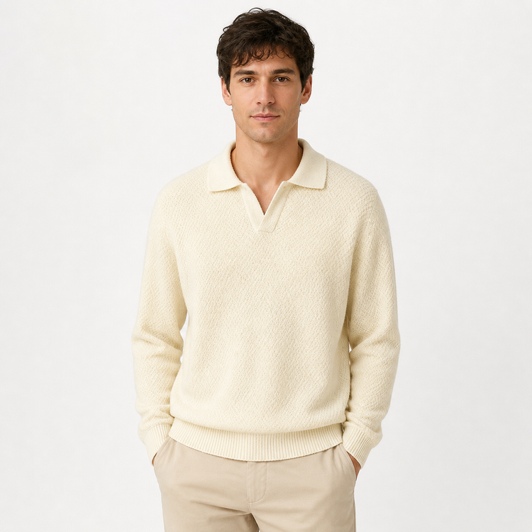 Man wearing a cream sweater and pants on a white background