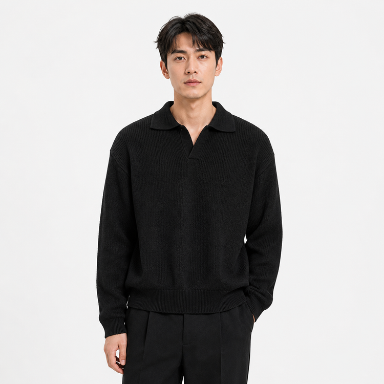 Man wearing a black sweater and pants on a light gray background