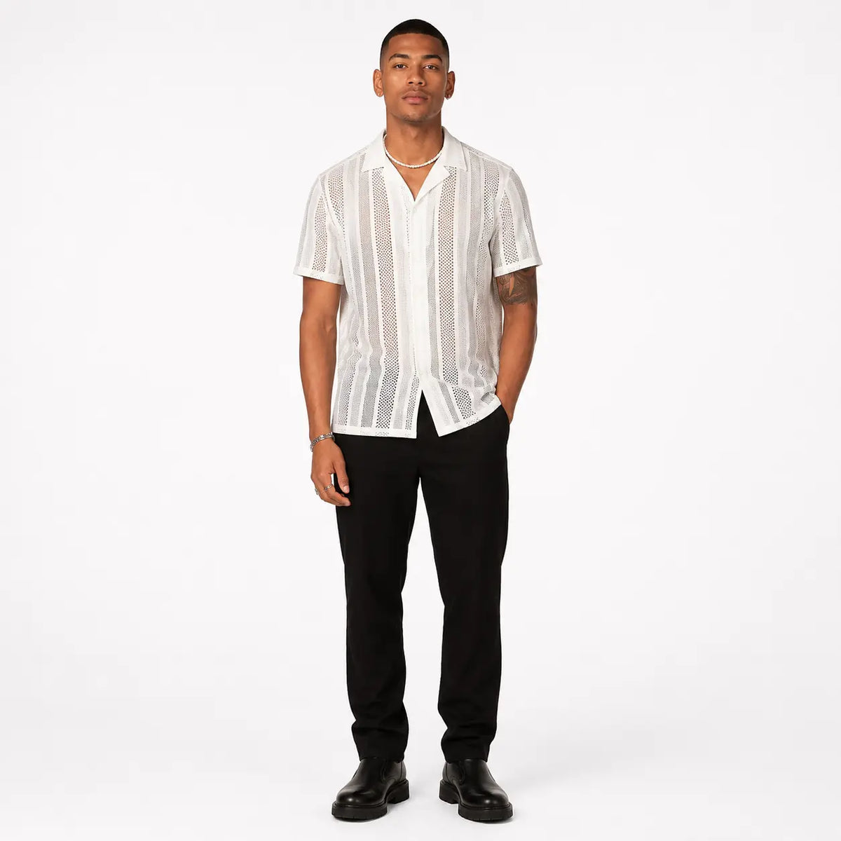 Button knitted short-sleeved shirt - stylish men's cardigan in white with vertical patterns, front view on model.