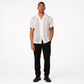 Man wearing a white textured shirt and black pants on a white background