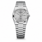 Silver watch with a white face on a white background