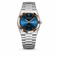 Silver watch with blue face and rose gold accents on a white background