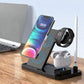 Multi-device wireless charging stand with smartphone, smartwatch, and earbuds on a desk.