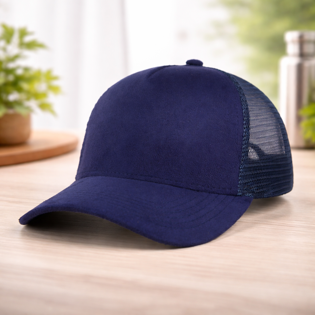Navy blue cap with mesh back on a wooden surface with a blurred background