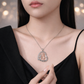 Necklace with a pendant worn by a person, against a blurred background