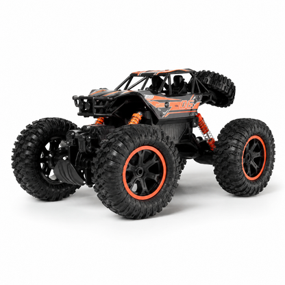 Black and orange remote control monster truck on a white background
