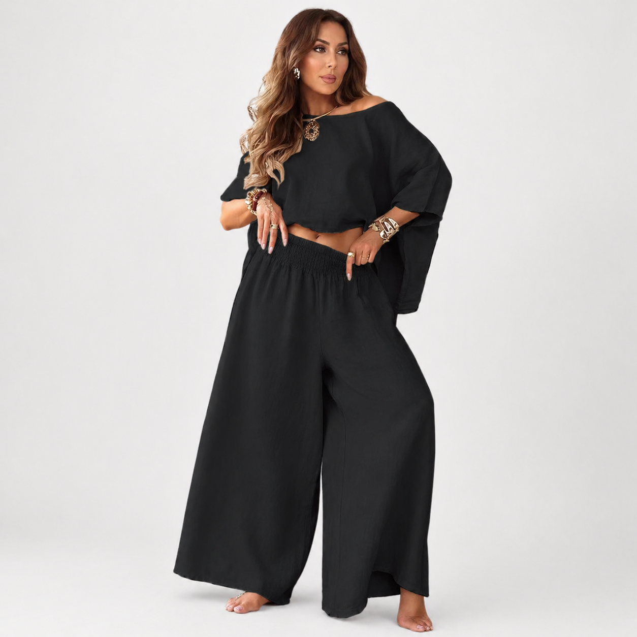 Woman wearing a black outfit with a white background