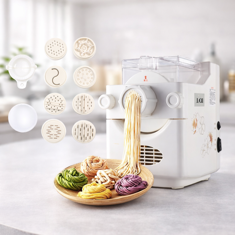 Pasta maker with various pasta shapes and a plate of freshly made pasta on a light background 