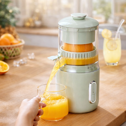 Person using a manual juicer to extract orange juice in a kitchen setting FRESH GREEN