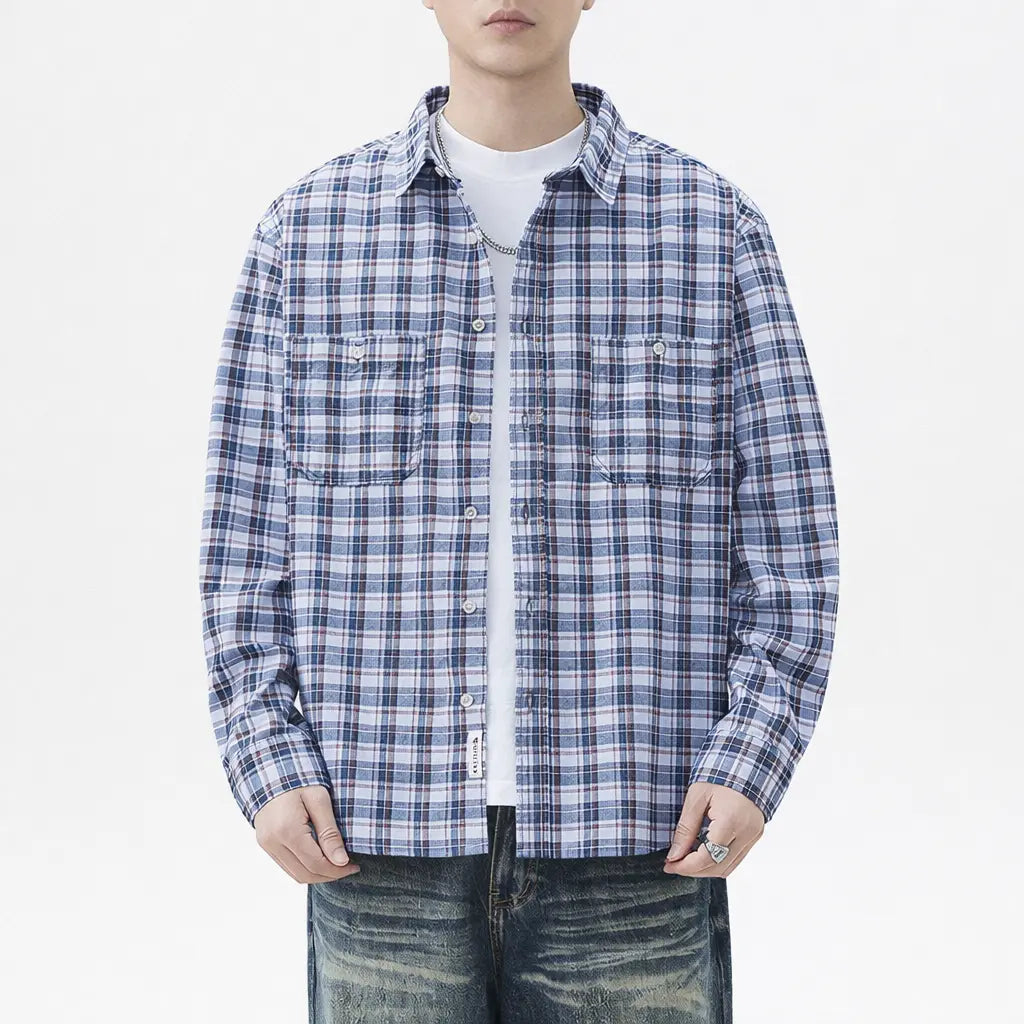 Person wearing a blue and white plaid shirt on a white background