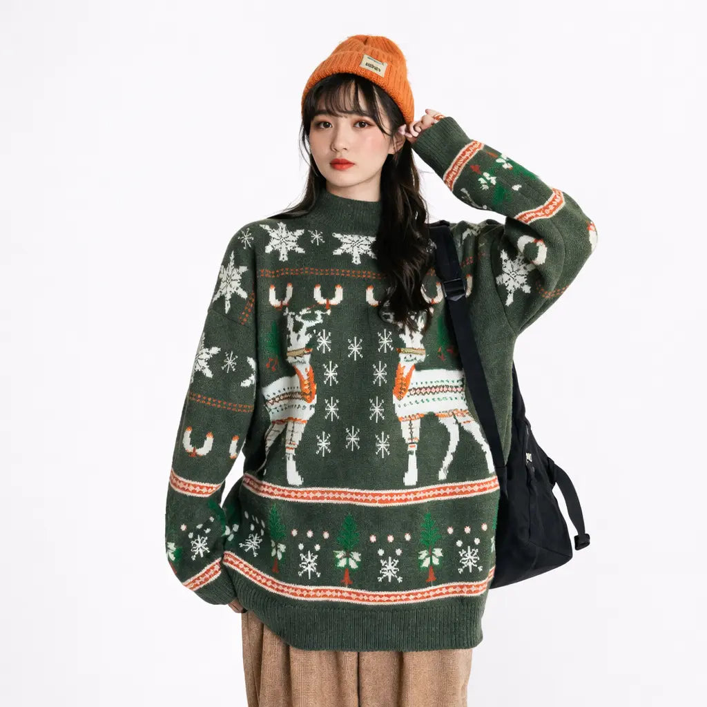 christmas elk knit sweater in navy blue, detail shot of the model’s chest area with white snowflake knit details and orange accents around the collar.