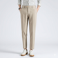 Person wearing beige pants and a striped shirt on a white background