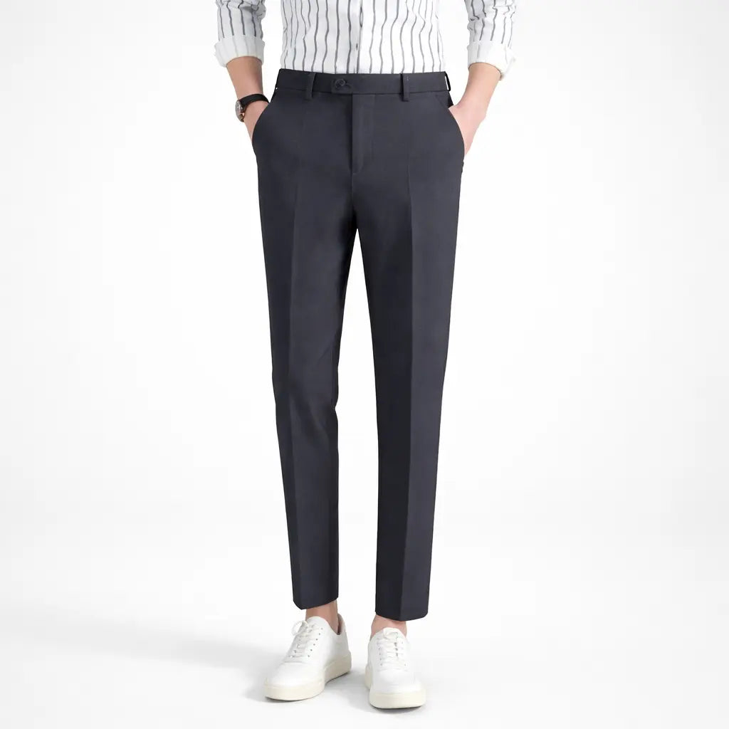 Men's casual sports pants, slim fit dark gray cotton blend front view on male model with white sneakers