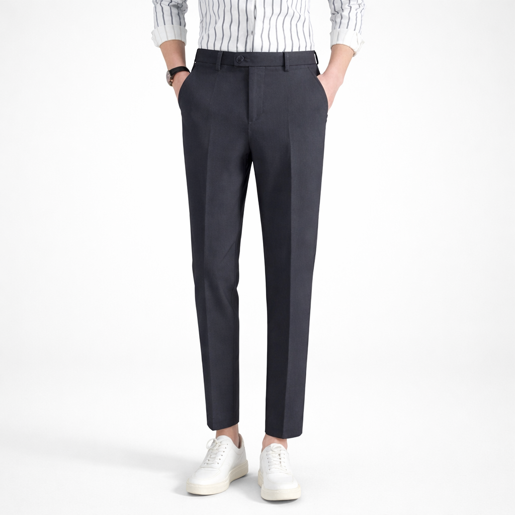 Person wearing dark gray pants with a white shirt on a white background
