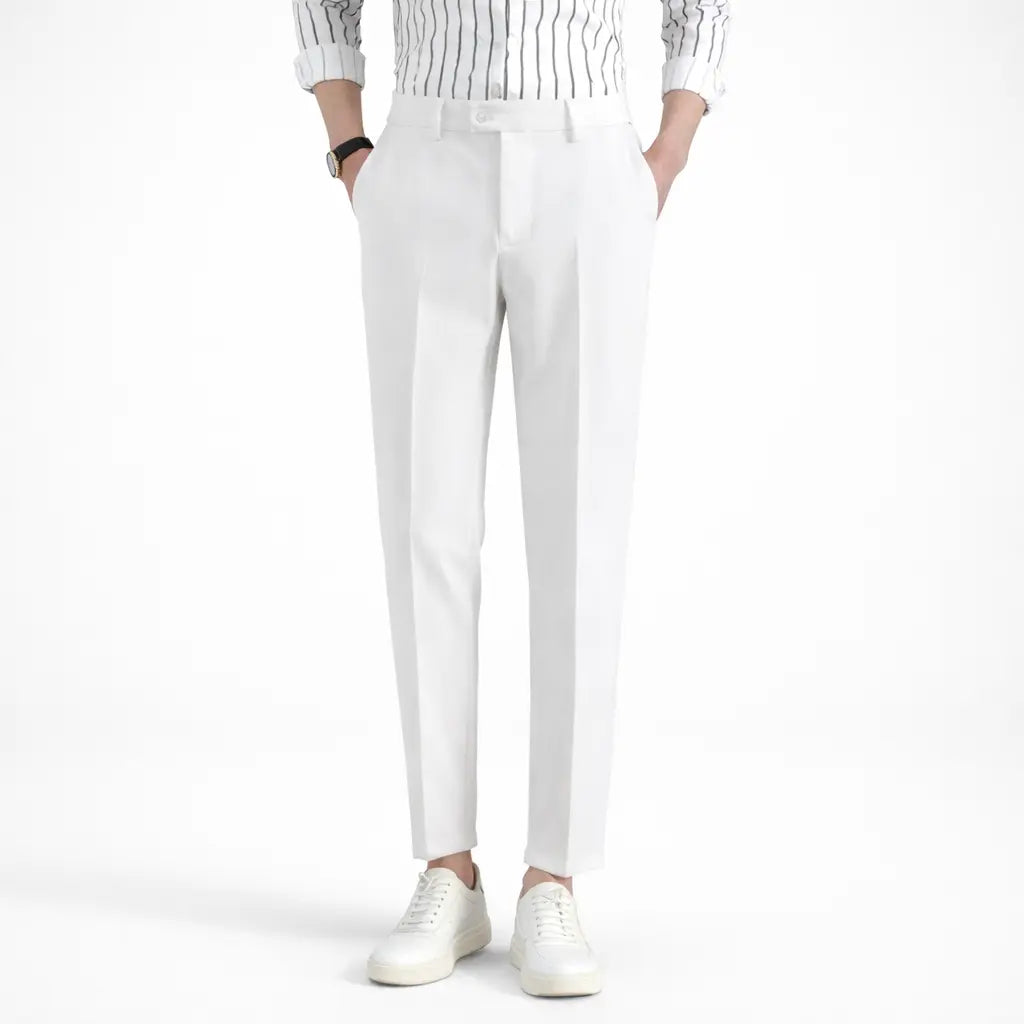 Person wearing white pants and a striped shirt on a white background