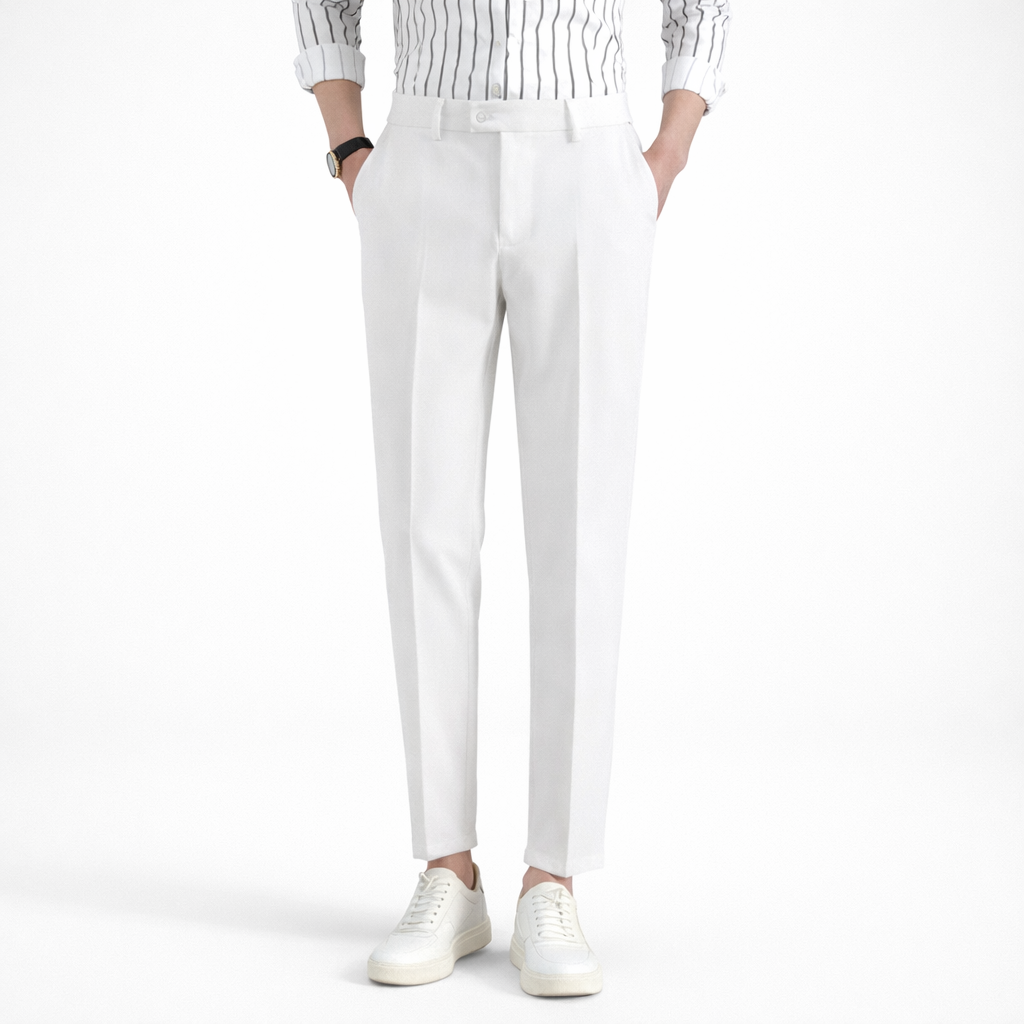 Person wearing white pants and a striped shirt on a white background
