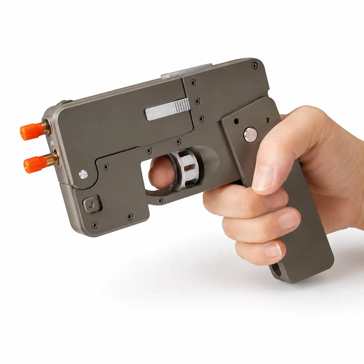Mobile phone-shaped foldable toy gun in gray with orange tips, held in hand showing trigger area.