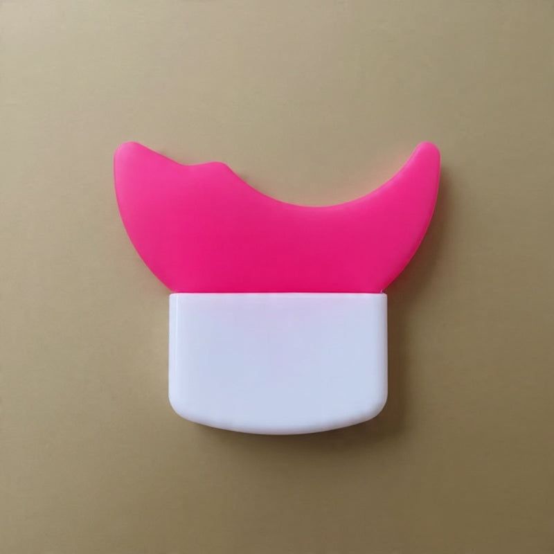 Pink and white device with a cat ear design on a beige background