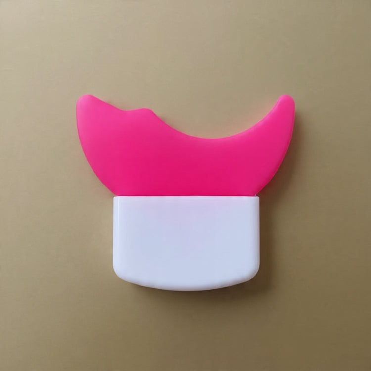 Pink and white device with a cat ear design on a beige background