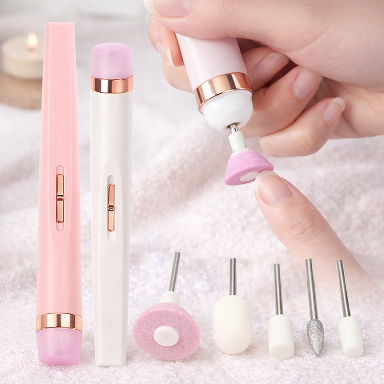 Pink and white nail drill with interchangeable heads on a soft background PINK