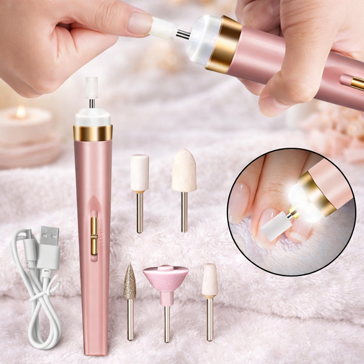 Pink nail drill with attachments and USB cable on a soft background PINK