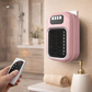 Pink wall-mounted electric heater with remote control in a bathroom setting