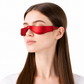 A woman with long brown hair wearing a sleek, red futuristic eye mask or visor, shown in profile against a solid white background.