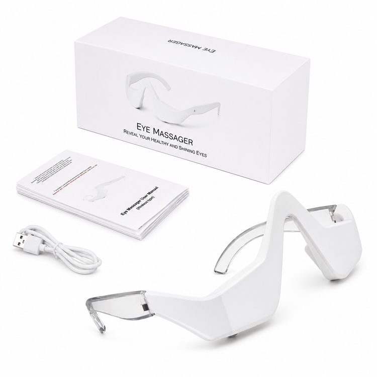 White electronic eye massager glasses shown with their white retail box, USB charging cable, and instruction booklet on a clean white background.