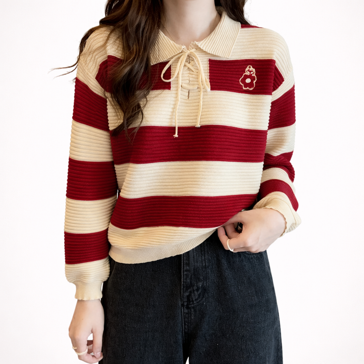 Red and beige striped sweater with a small logo on a white background