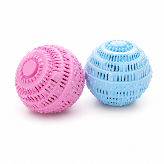 Pink and blue laundry balls on a white background