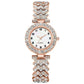 Rose gold watch with diamond-studded band on a white background